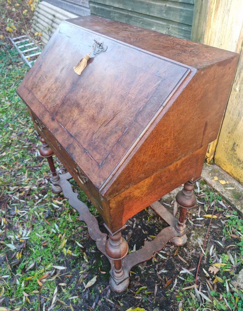 A Queen Anne style burr walnut and burr elm slant-front writing bureau raised on turned legs with a stretcher base. View XIV