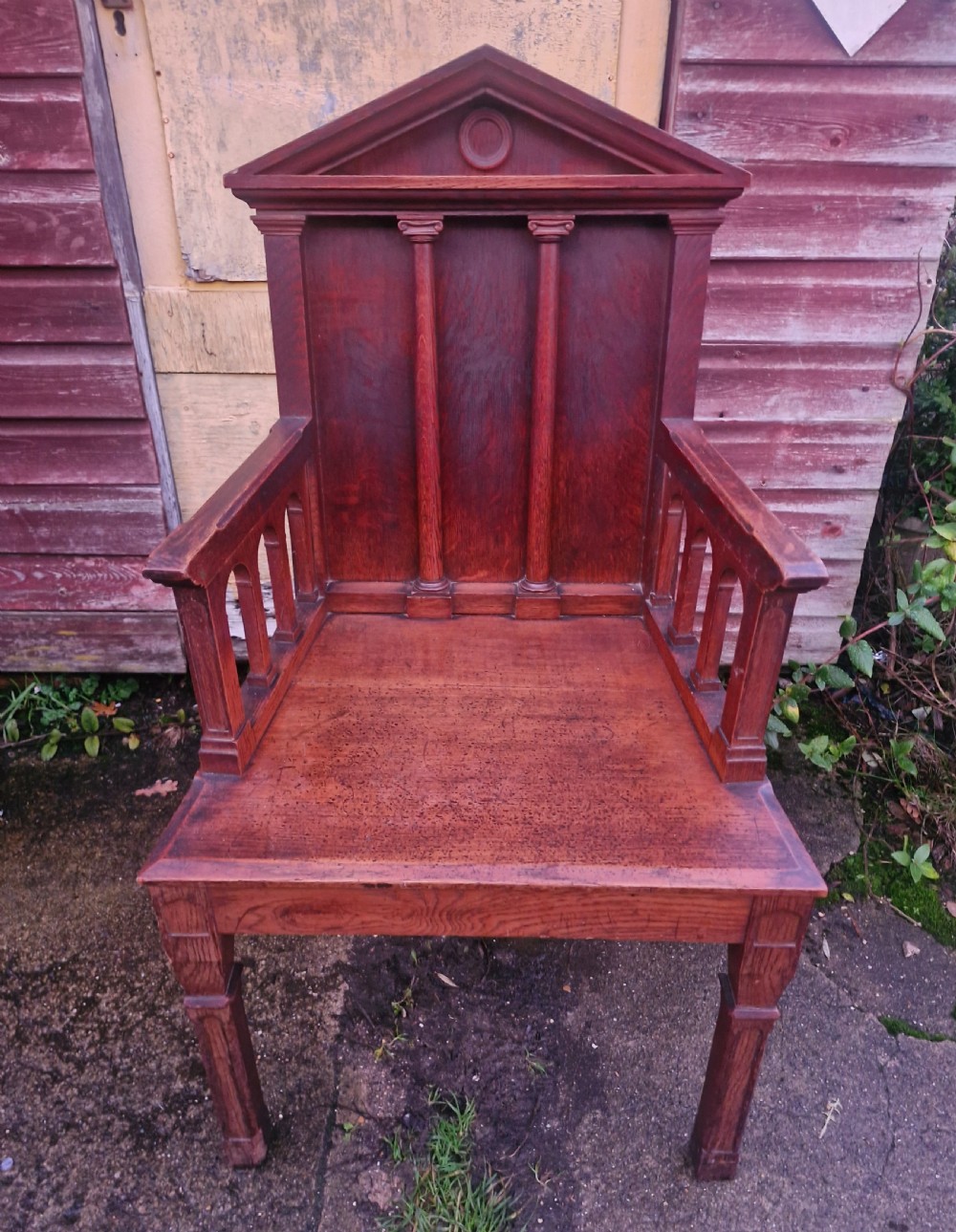 Early Victorian oak hall armchair. 
