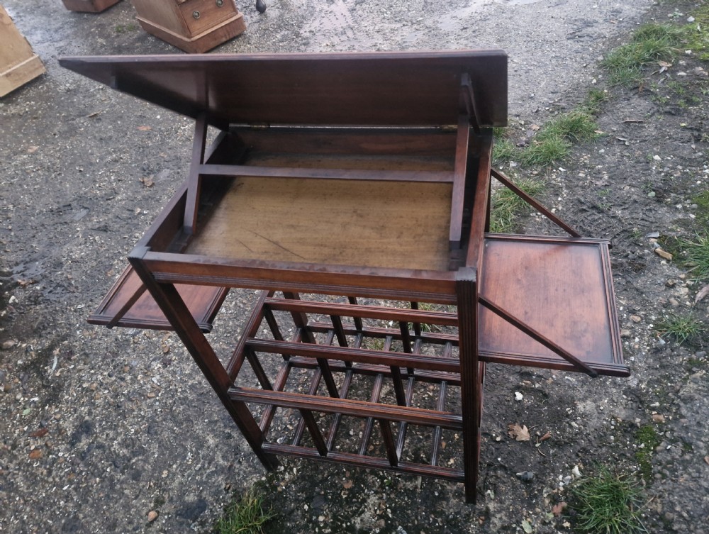 Unusual late Victorian music table. View VIII