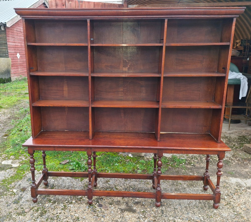 Edwardian oak open front bookcase in 2 parts.