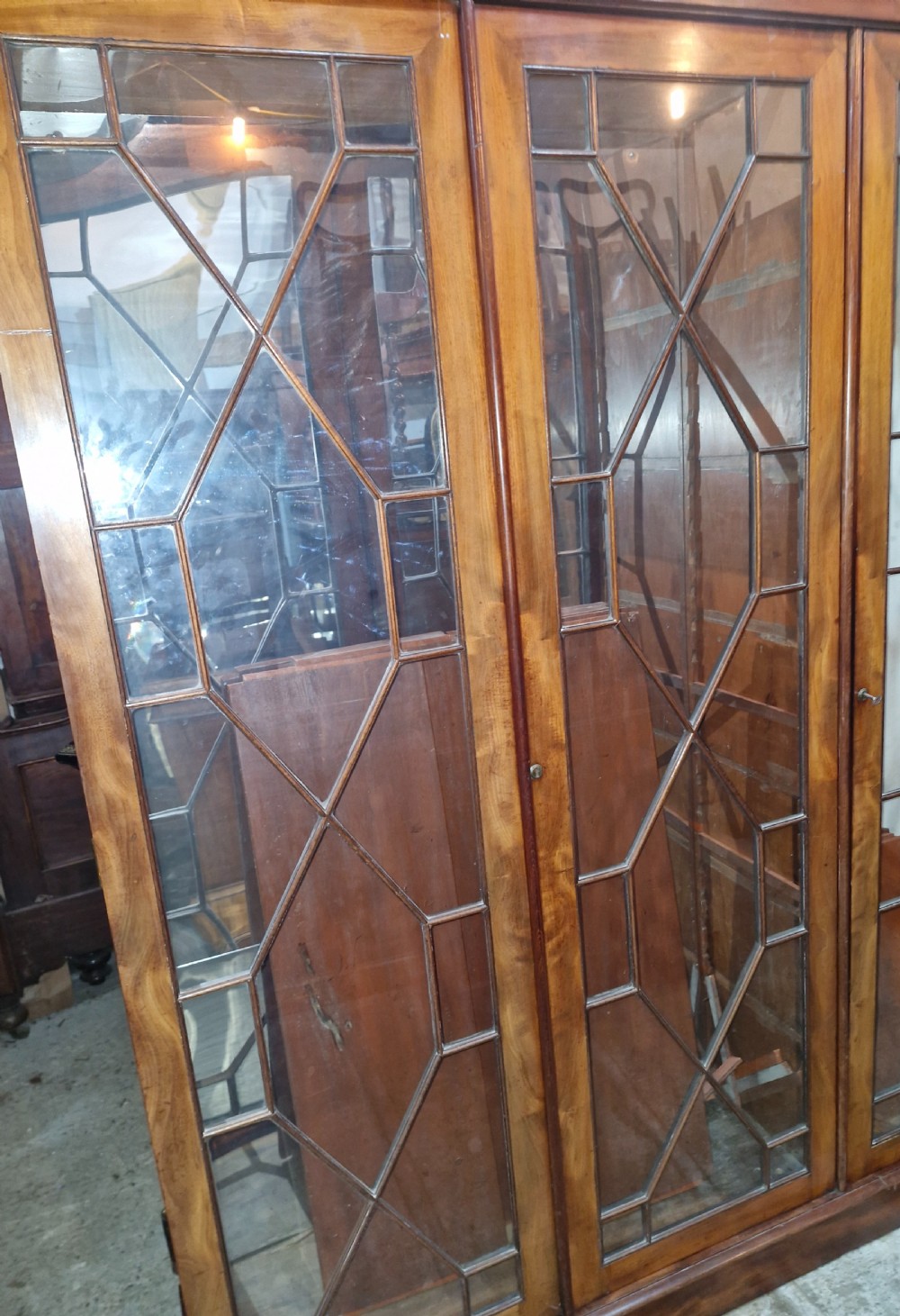 Mahogany 3 door glazed bookcase cabinet,adjustable shelves.  View IX