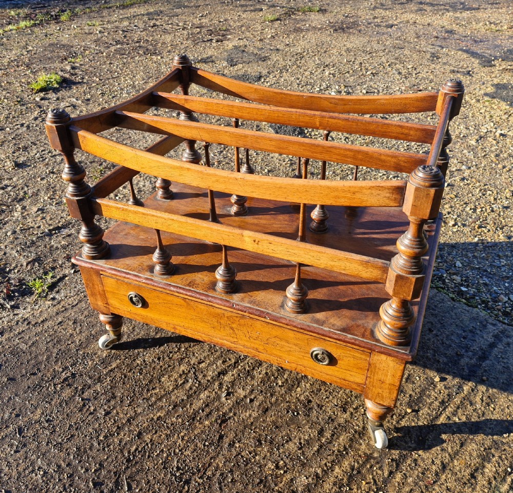 Early Victorian rosewood Canterbury with Stamped Castors. 