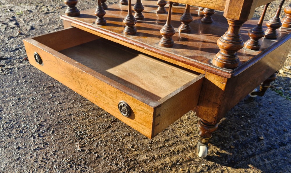 Early Victorian rosewood Canterbury with Stamped Castors.  View VII