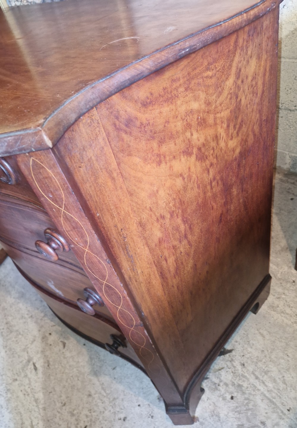 Early 19th century line inlaid mahogany serpentine front chest of drawers.  View III