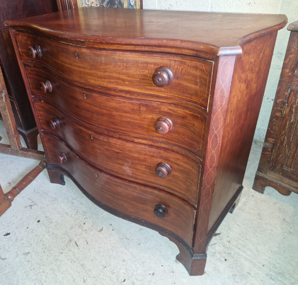 Early 19th century line inlaid mahogany serpentine front chest of drawers.  View IV