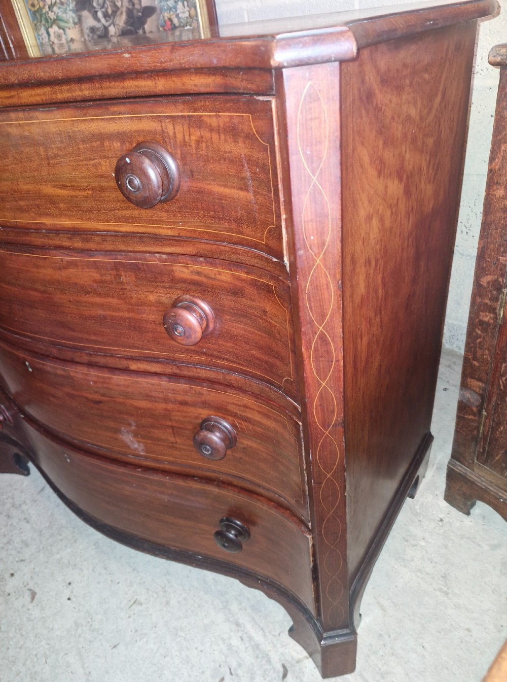 Early 19th century line inlaid mahogany serpentine front chest of drawers.  View VII