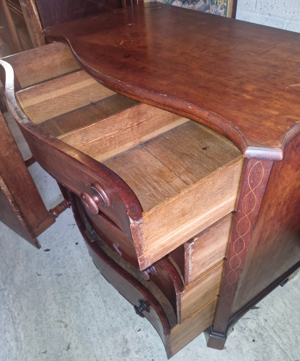 Early 19th century line inlaid mahogany serpentine front chest of drawers.  View X