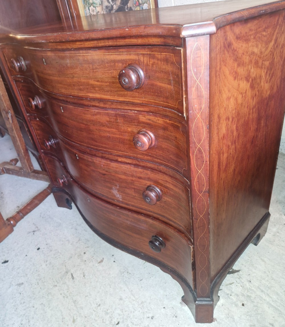 Early 19th century line inlaid mahogany serpentine front chest of drawers.  View XI