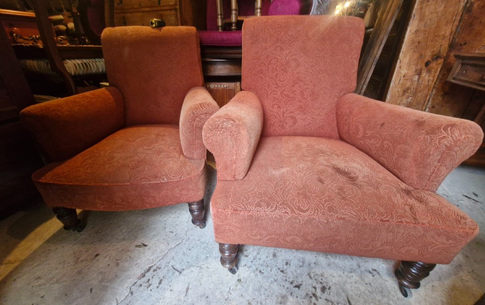 A close matched pair of upholstered armchairs.  View II