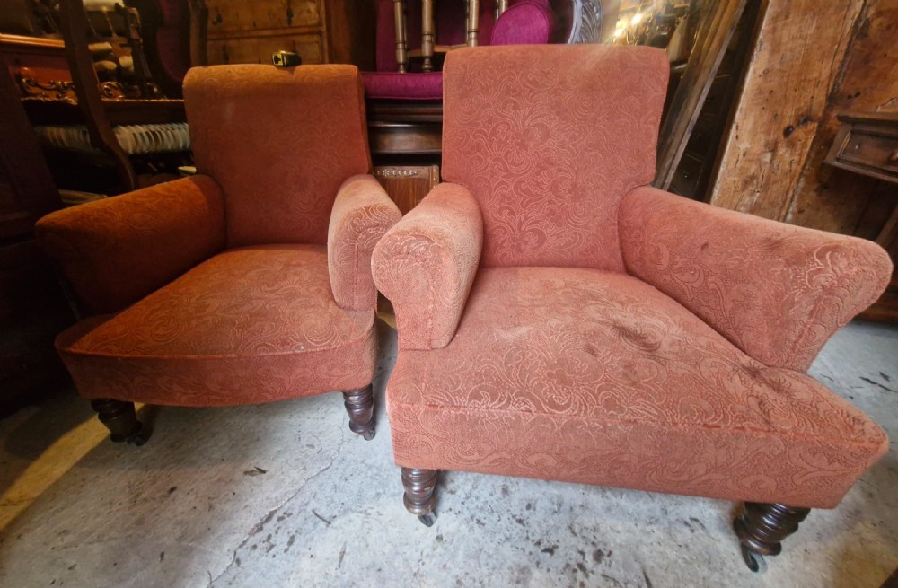 A close matched pair of upholstered armchairs.  View III