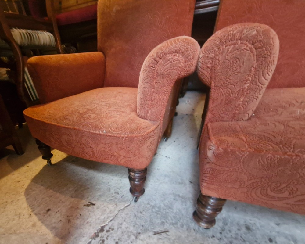 A close matched pair of upholstered armchairs.  View V