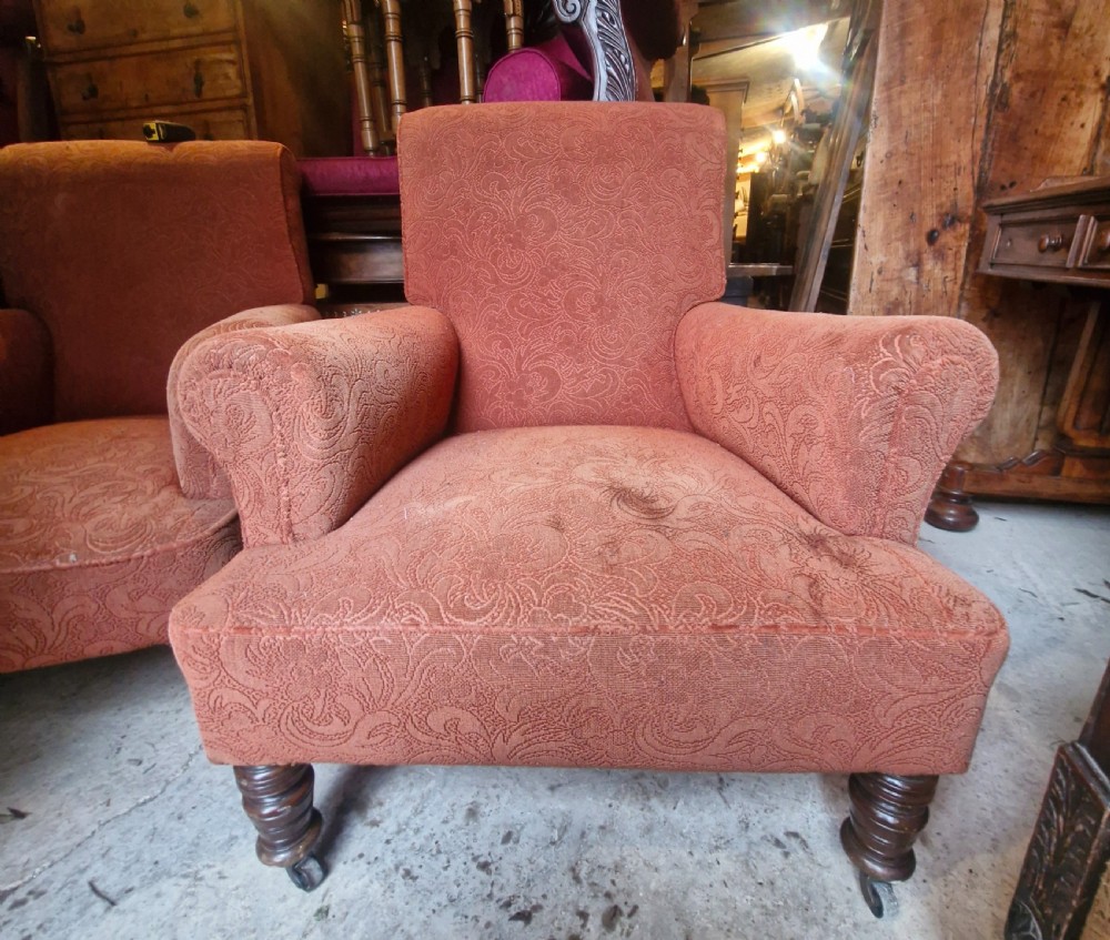 A close matched pair of upholstered armchairs.  View VI