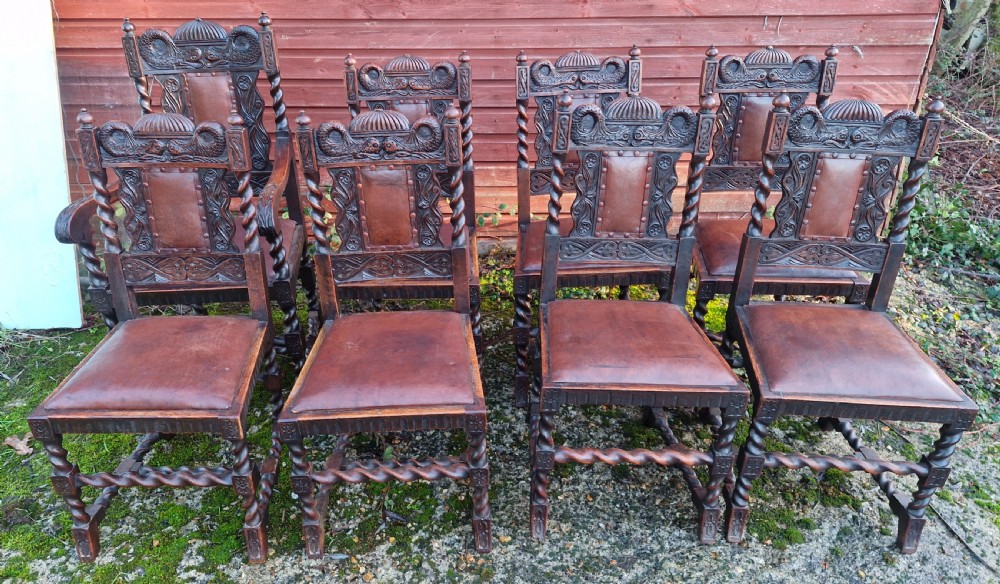 Good set of Edwardian carved oak dining chairs. With carved Dolphins. 
