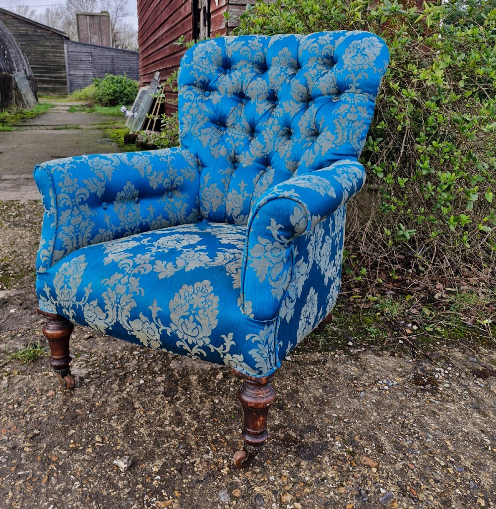 Victorian button back upholstered armchair. 