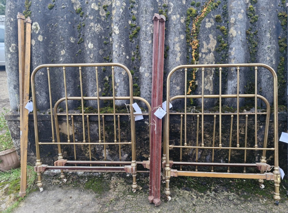 Pair of Edwardian brass single beds.