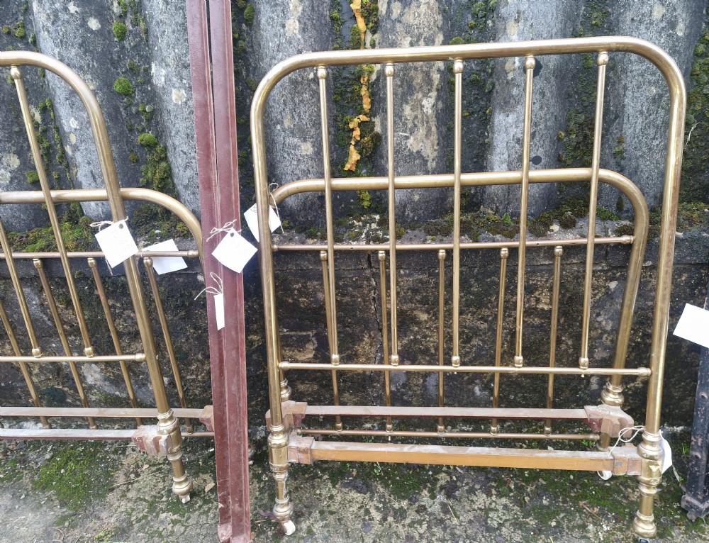 Pair of Edwardian brass single beds. View VII