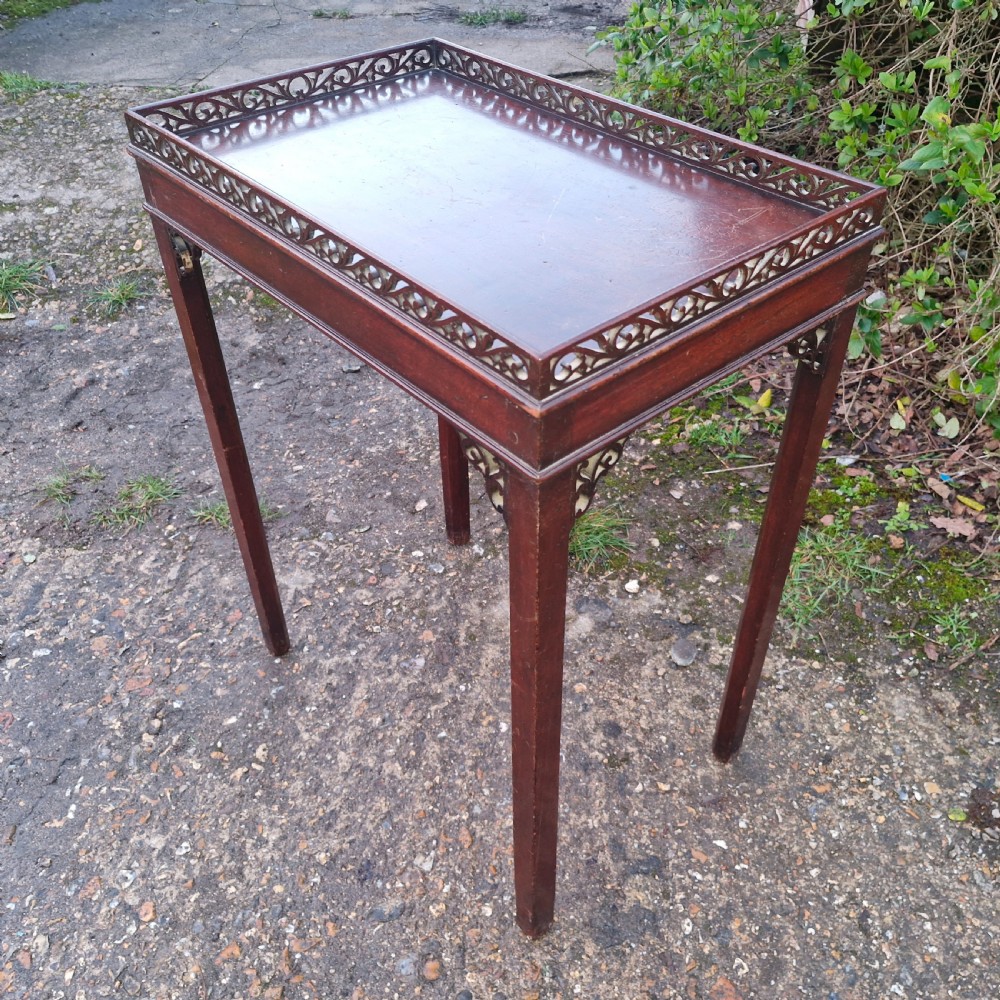 Small mahogany silver table with fret work gallery.  View VII