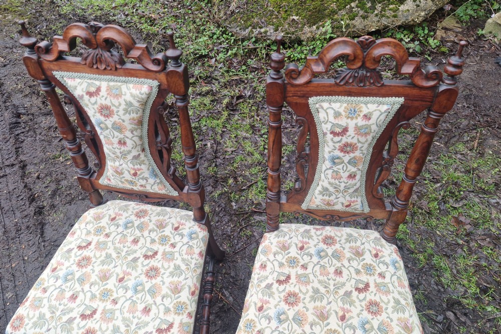 A pair of mid-19th century carved rosewood side chairs with floral tapestry upholstered seats and back pads. View III