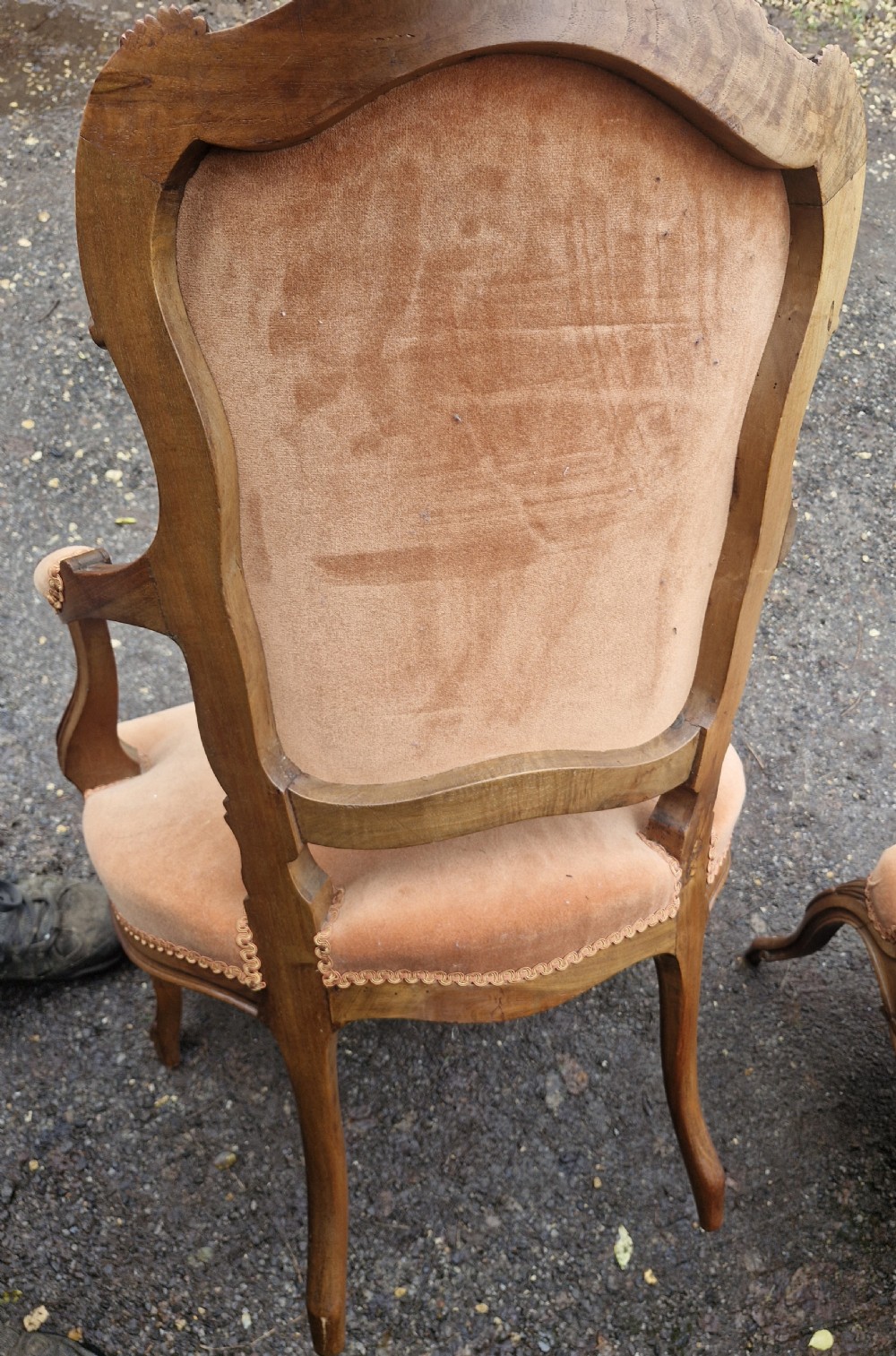 A pair of French Louis XV style carved walnut fauteuil armchairs with open padded armrests and peach velvet upholstery. View VII
