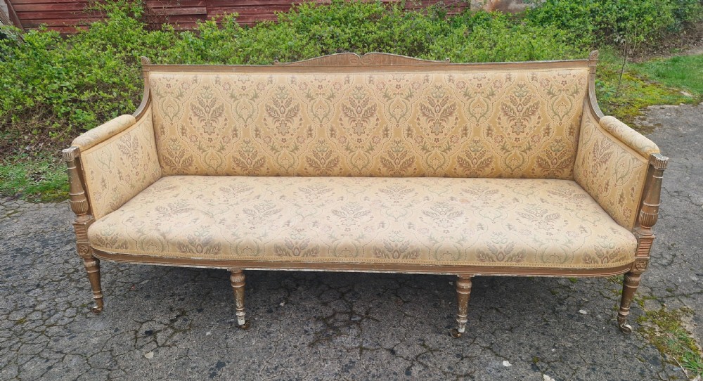 Very large formal gilt country house hall sofa.
