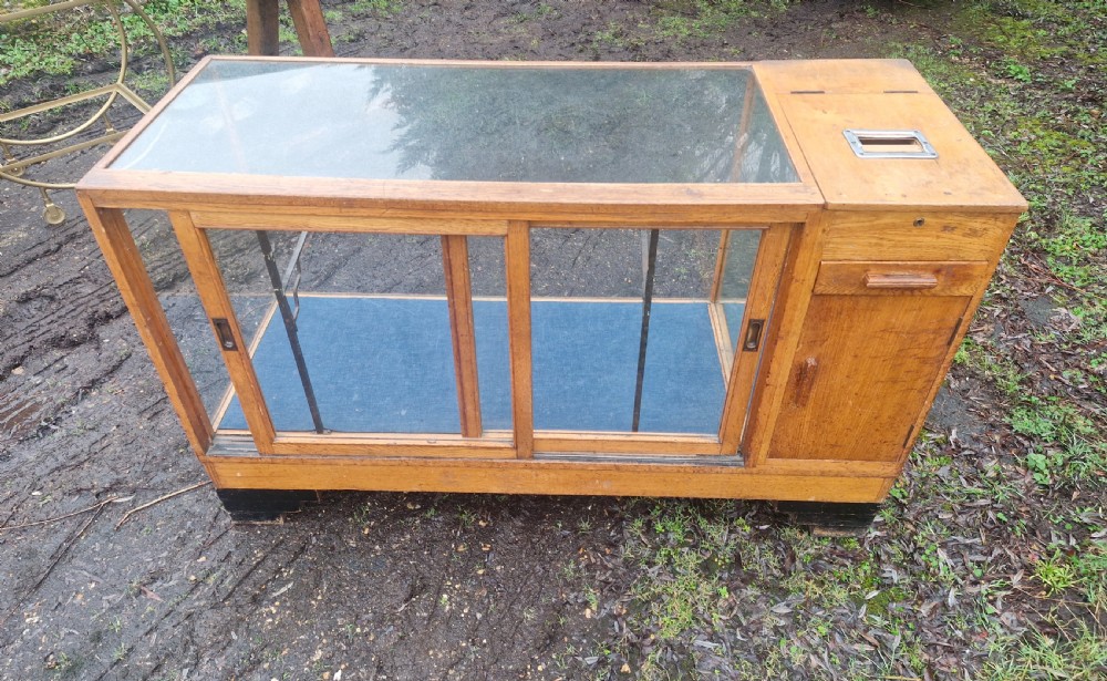 Oak shop cabinet complete with till and working bell.