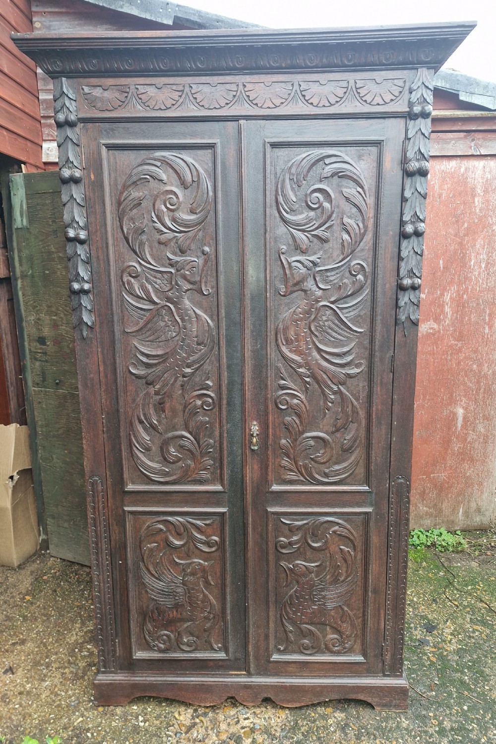 Useful late Victorian carved oak 2 door cupboard. Fitted shelves. 