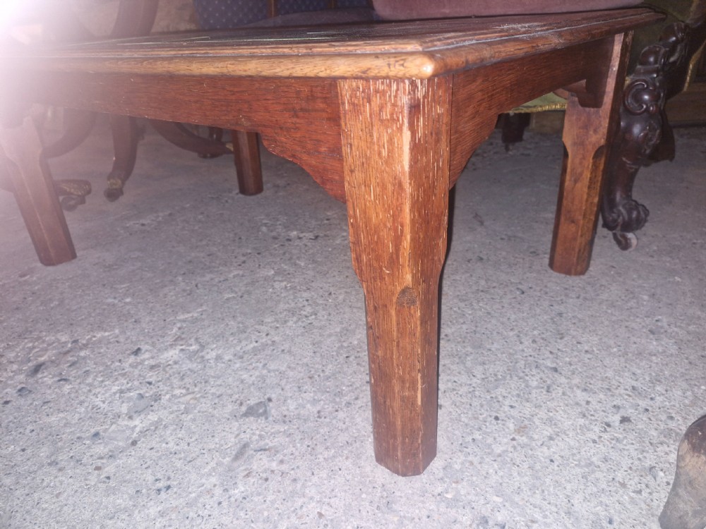 A low rectangular oak coffee table featuring an inset top crafted from square dark green glazed ceramic tiles. View II