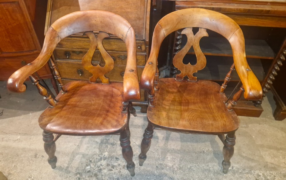 Pair of Victorian Smokers bow armchairs.