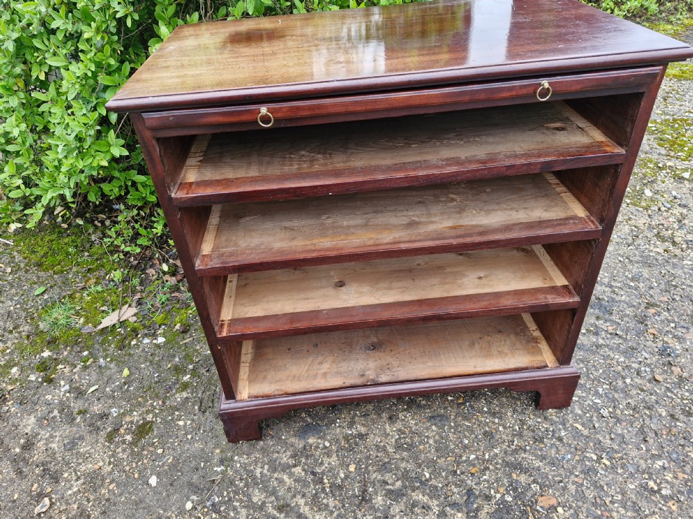 An 18th-century Georgian mahogany chest of drawers featuring four graduated drawers with brass swan-neck handles, a pull-out brushing slide, and bracket feet. View III