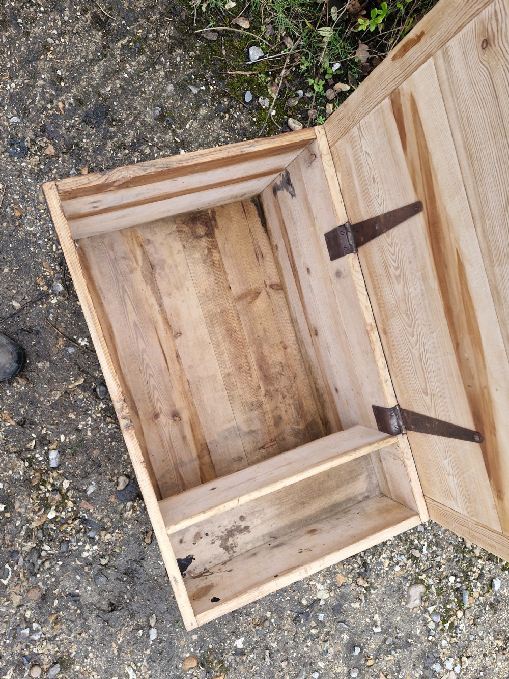 A late Victorian natural pine travelling trunk featuring iron corner brackets, dovetail joinery, and a GPO stencil mark on the front panel. View III