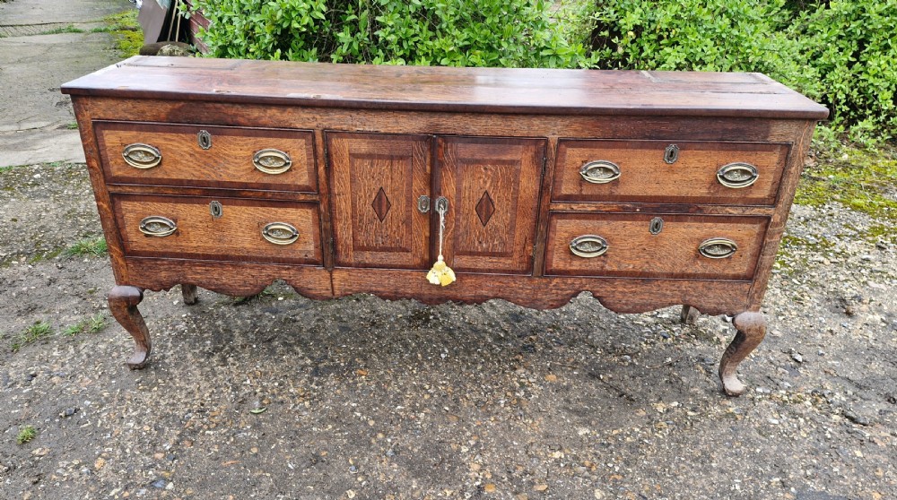 Antique Shropshire oak and banded dresser base. 