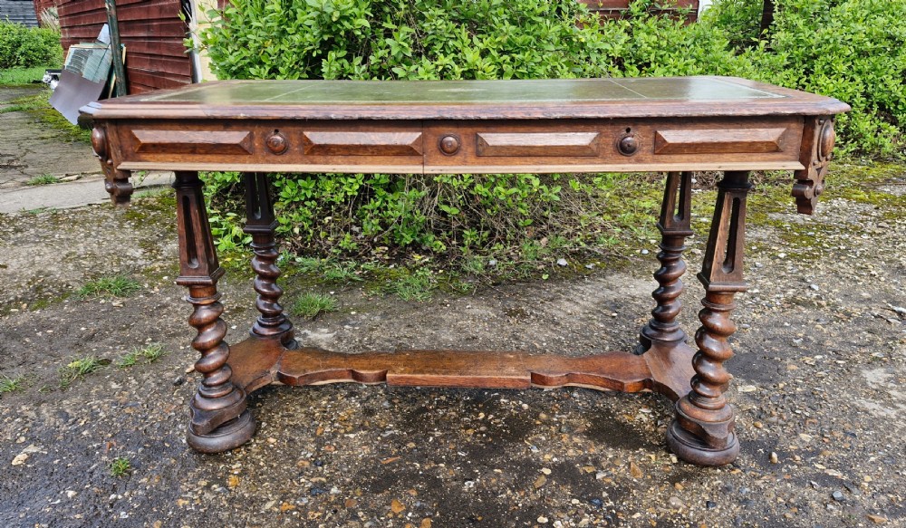 Early Victorian oak Gothic 2 drawer writing table in the manner of Richard Bridgen. 