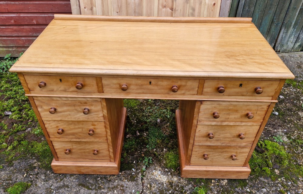 Victorian satinbirch kneehole pedestal writing desk by Heals.
