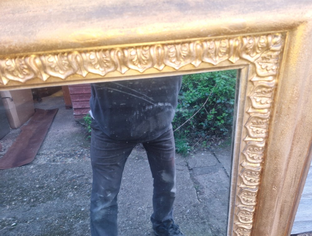 A large 19th-century rectangular overmantel mirror featuring an ornate gilded frame with classical repeating egg-and-dart moulding. View III