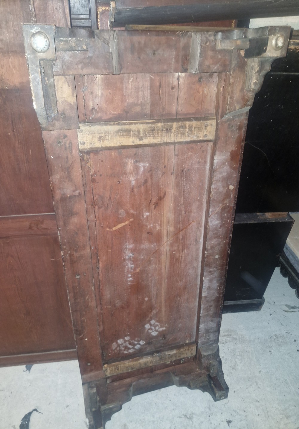 A Late Georgian mahogany wardrobe featuring two large panelled doors above multiple lower drawers with turned wooden knobs. View VII
