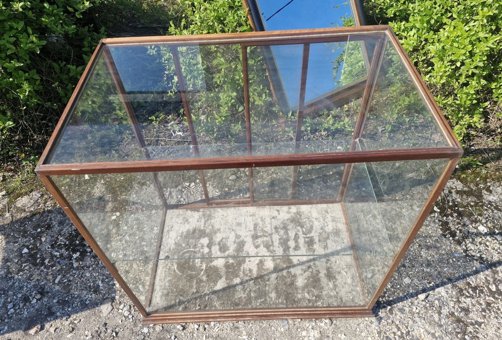 A rectangular glazed tabletop shop display cabinet featuring a dark mahogany timber frame, glass side panels, a glass top, and a single internal glass shelf. View V