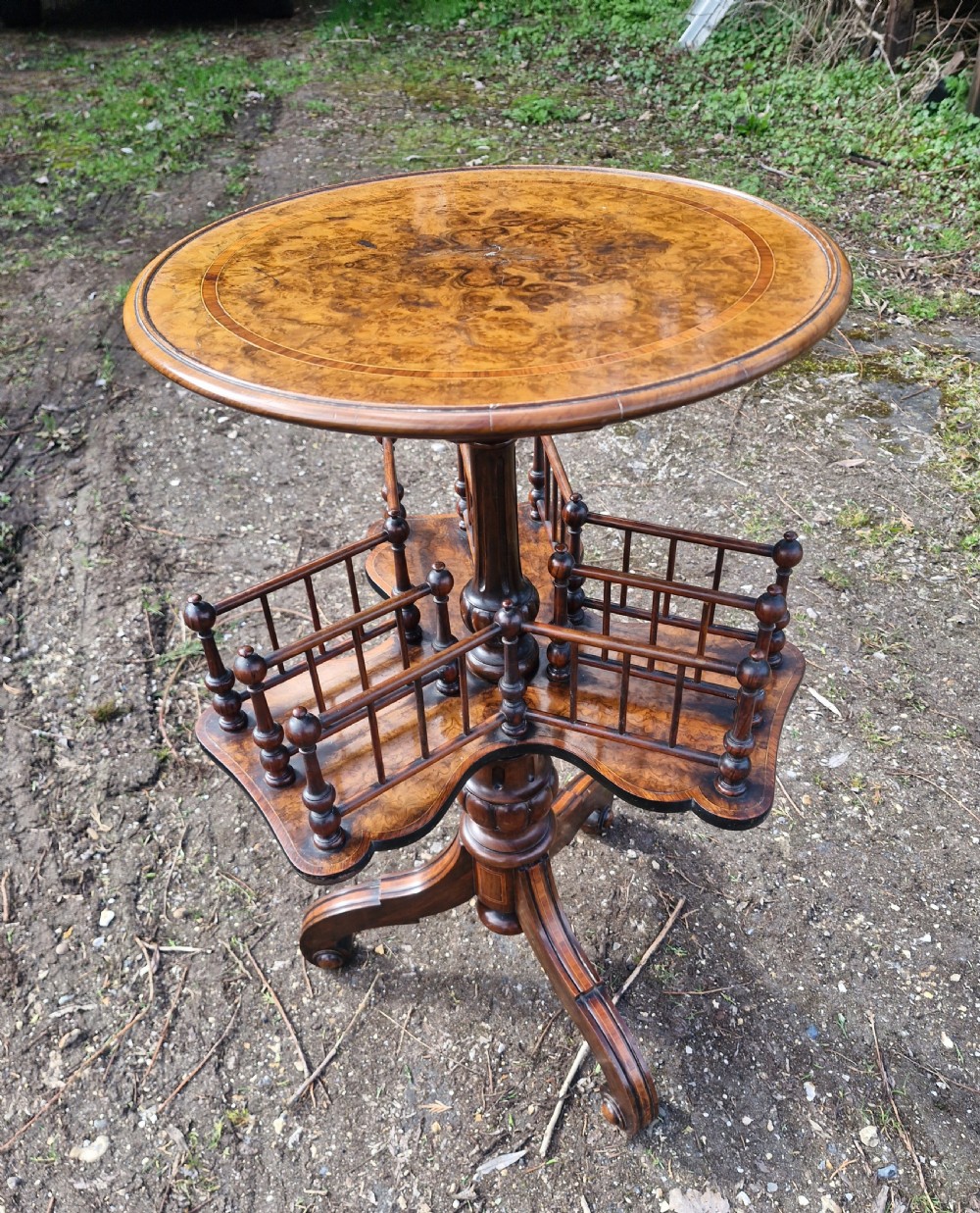 Mid Victorian inlaid walnut revolving book table.