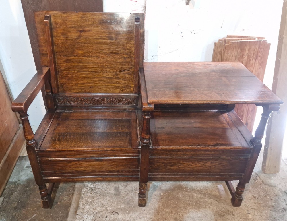 Oak double fold over top hall seat with lift up lid.