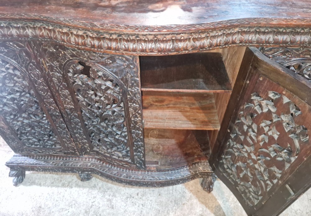 Carved Anglo Indian 4 door side cabinet. 
 View II