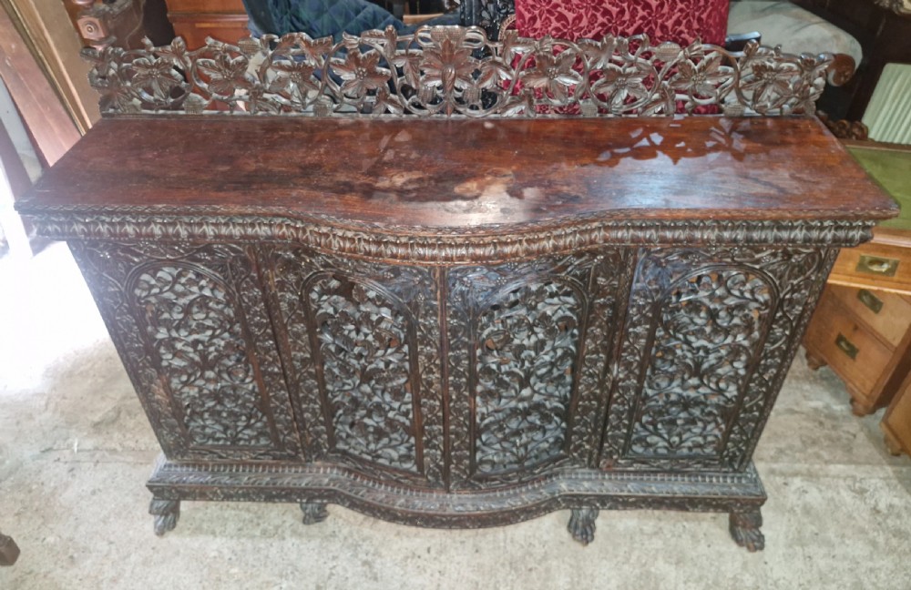 Carved Anglo Indian 4 door side cabinet. 
 View III