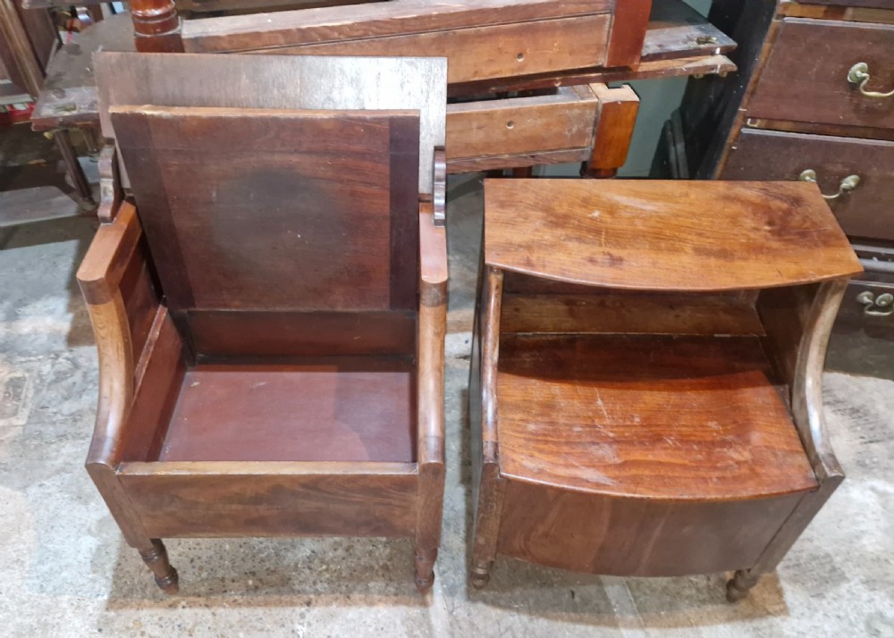 A pair of late Georgian mahogany two-tiered bedside tables with turned front legs and curved side supports. View V