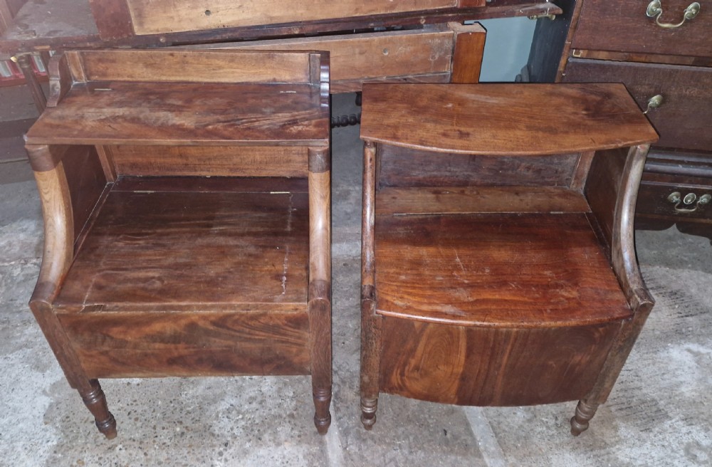 A pair of late Georgian mahogany two-tiered bedside tables with turned front legs and curved side supports. View VI
