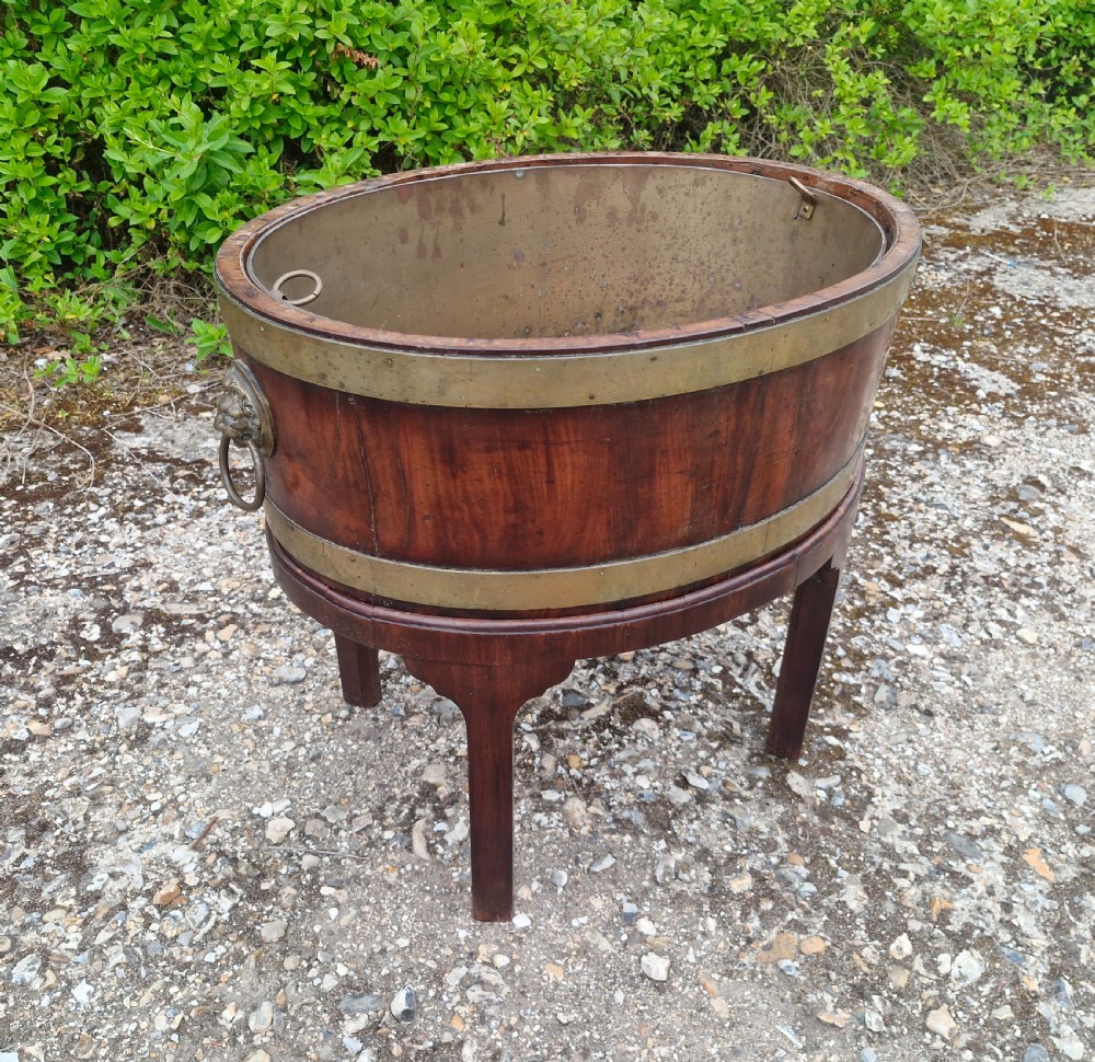 Late Georgian mahogany brass bound wine cooler or plant jardiniere. 