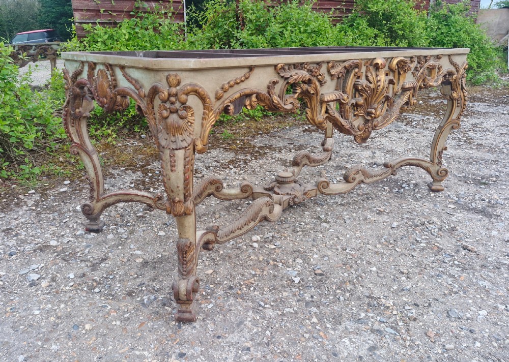 Carved and painted table base.