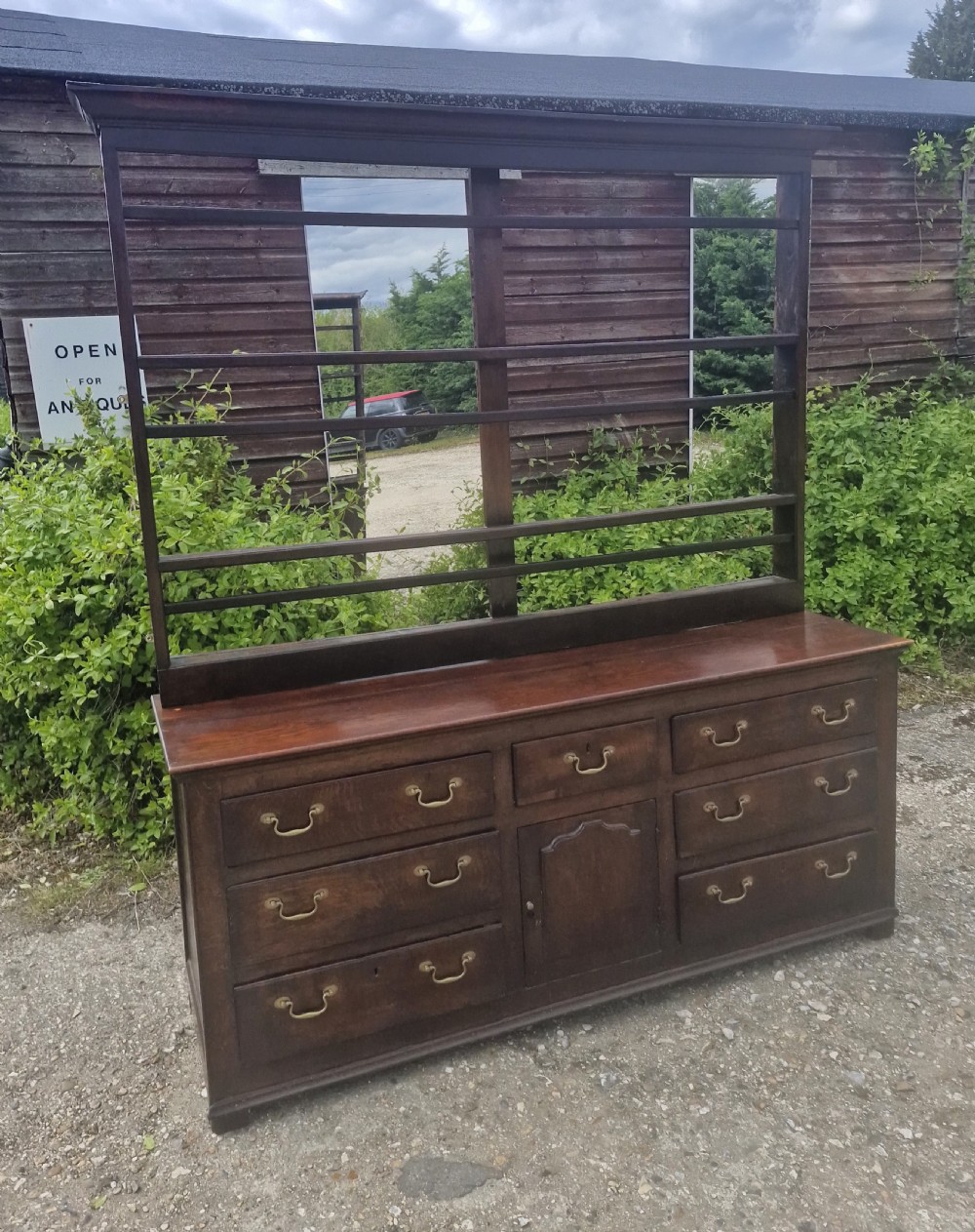 Early 19th century oak dresser with rack.
