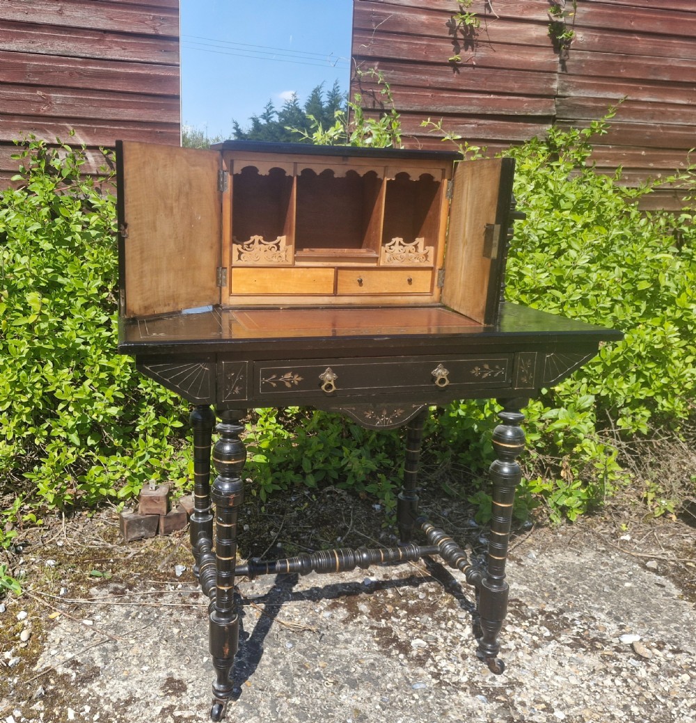Victorian ebonised writing table. 