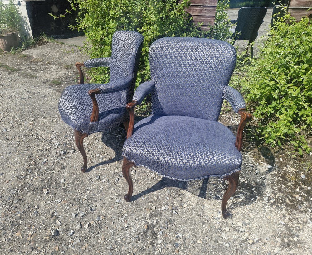 A pair of open arm armchairs with carved mahogany cabriole legs and blue patterned fabric upholstery. View III