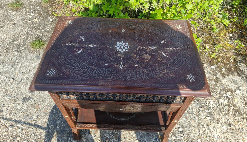 Moorish occasional table with drop sides. View VI