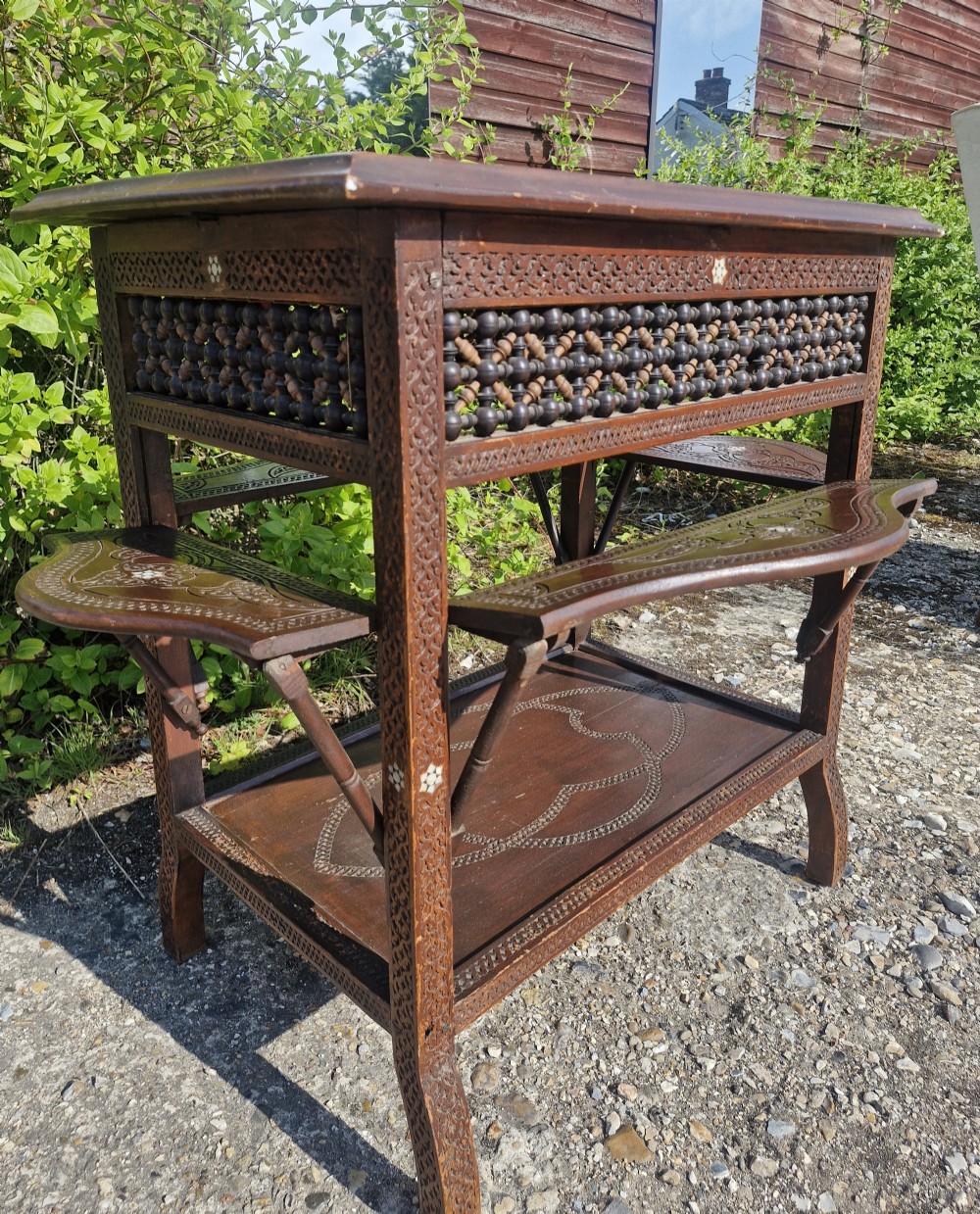 Moorish occasional table with drop sides. View VII