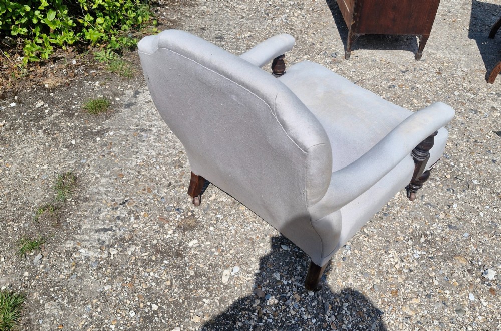 Edwardian low seat upholstered armchair in the Howard style.  View II